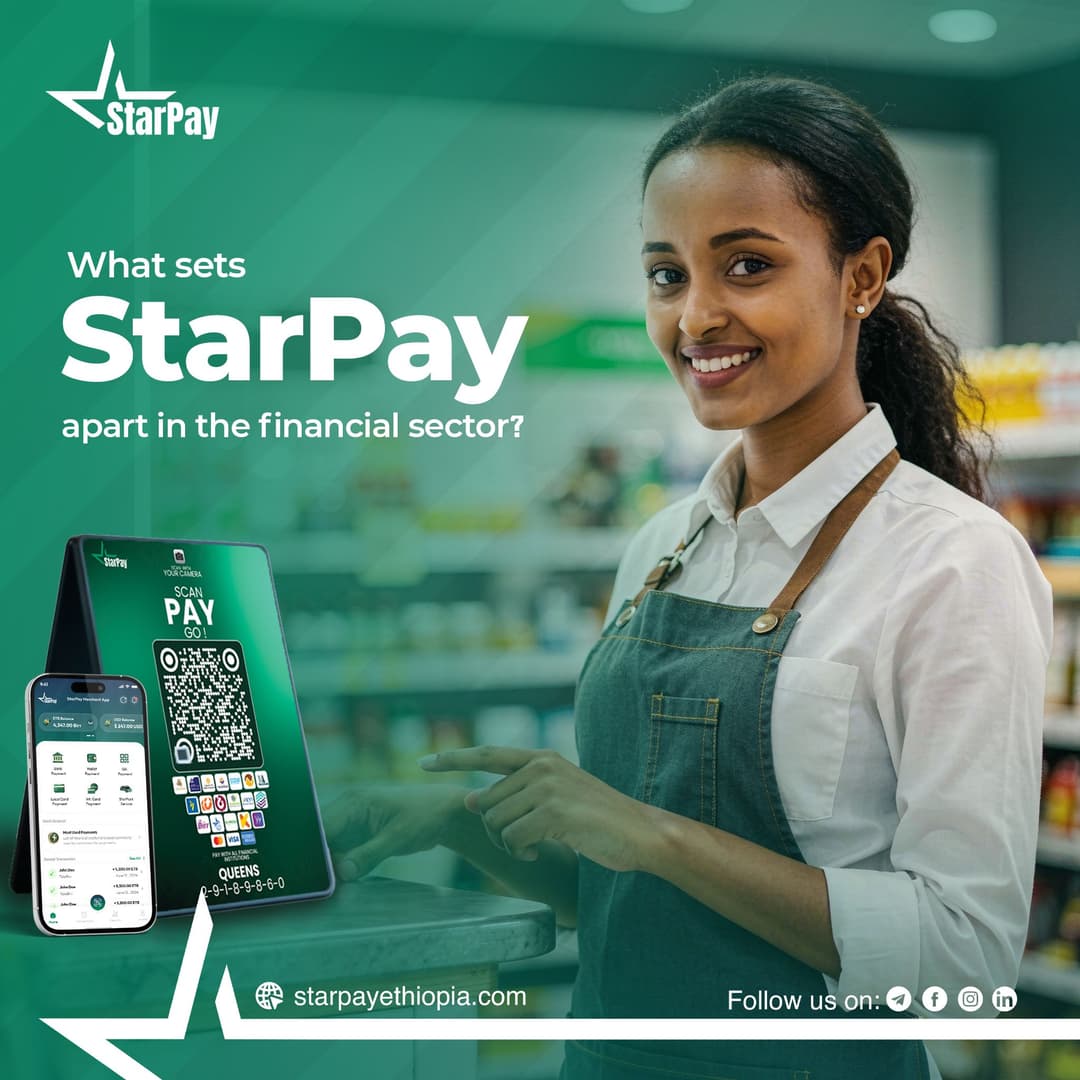 StarPay QR payment stand and merchant app displayed in a retail store, with attendant pointing to the "Scan, Pay, Go" screen